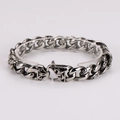 Close-up of vintage silver stainless steel chain bracelet with embossed leopard patterns - Steel