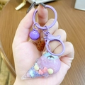 Cute purple liquid ice cream keychain with glitter beads and a small purple bell charm - Mini Ice Cream Milk Bean - Purple