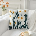 White embroidered pillowcase with yellow flowers on a sofa in a modern home setting - Green Small Daisy (Cover Only)