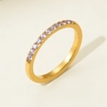 Detail of titanium steel ring featuring pink round-cut zircons in a micro-pave setting - US 6 / Pink