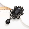 DIY phone case charm featuring a black oval gem with sunburst crystals and droplet pendant - Gun Black Black Gem Pendant