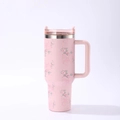 Detail of pink floral and bow pattern on a 40oz stainless steel insulated tumbler - 40oz / Pink