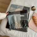 Blue and beige plaid scarf with fringe, soft knit texture on white bedding - Blue Grey Grid