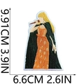 Detailed embroidered patch of a female singer in orange dress measuring 9.91cm x 6.6cm - W3GS-22-02