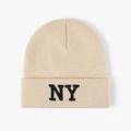 Beige knit beanie with NY embroidery, warm winter hat with turn-up cuff on white background - One Size / Beige