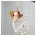 Detail of plush angel Christmas ornament with golden wings and sequin star on a branch - Star Vertical