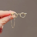 Elegant gold glasses brooch with dangling chain displayed on hand against a plain background - 285# Glasses