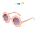Pink sunflower-shaped sunglasses for kids with matte finish and dark round lenses - Pink