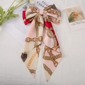 Pink and red satin bow hair clip with gold chain print and long flowing ribbons - Pink Chain