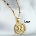 Golden Leo zodiac necklace with micro-inlaid zircons on a white satin background - Leo