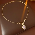 Detailed macro of a vintage gold necklace featuring purple stones and zircon accents - Necklace-Purple (Real Gold Plating) / Purple