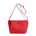 Minimalist red nylon dumpling crossbody bag with adjustable strap and front snap pocket - Red