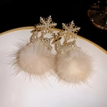 Detailed macro view of reindeer Christmas earrings with sparkling zircons and plush pom-poms - Gold Reindeer Fur Ball Rhinestone Earrings