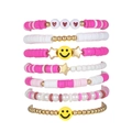 Set van 7 kleurrijke Boho kralenarmbanden met roze parels en gele smiley-bedeltjes - 7-delige Set - Inclusief Glimlach Hart Ster Bedels / Roze Serie Gelaagde Armband Set