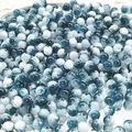 Macro shot of 10mm blue and white gradient cracked glass beads for DIY jewelry making - 8mm Semi-white Sea Blue