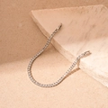 Macro detail of a silver tennis bracelet with square-cut crystals on stone props - Silver Zircon Buckle Bracelet / Silver