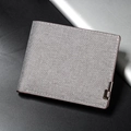 Light grey denim texture bi-fold wallet with brown trim and metal stud accent - Off-White