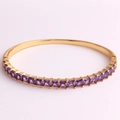 Close-up of 18K gold plated bangle featuring purple square-cut AAA cubic zirconia stones - Purple Zircon