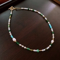 Macro view of vintage beaded necklace with pearls, green agate stones and golden OT clasp - Multicolor Beaded OT Necklace
