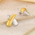 Close-up of X-shaped gold and silver bicolor earrings on textured stone surface - High Gloss Mirror X-Shape Style (KE118750-SP)