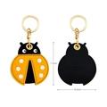 Ladybug leather Airtag case and keychain with yellow finish and metallic gold ring - Ladybug