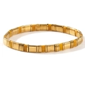 Bohemian Tila stretch bracelet featuring gold-tone beads and vibrant yellow enamel tiles - Yellow