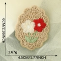 Knitted red and white flower patch accessory with green leaves, size 6cm by 4.5cm - Green Edge Red and White Flowers