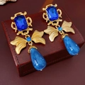 Vintage Baroque style earrings with blue teardrop pendants on brown leather box - Silver Earring Post Rhinestone Bow Teardrop Stud Earrings