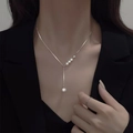 Silver Y-shaped layered butterfly necklace featuring gradient white pearls on a fine chain - Silver White Pearl Necklace