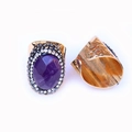 Detailed macro view of vintage purple agate ring with rhinestone settings and gold finish - Purple Crystal