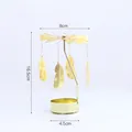Golden rotating spinning candle holder featuring delicate hanging metal feathers ornaments - Feather Style / Gold