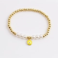 Elegantes Goldperlen-Armband mit weißen Perlen und gelbem Böser-Blick-Anhänger - Gelb