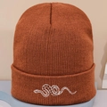Classic knitted beanie in caramel brown with detailed white snake embroidery on cuff - Embroidered Snake / Caramel color
