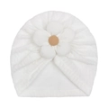 Detailed view of the soft knitted white baby turban with a large 3D flower decorative knot - White
