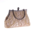 Close-up of champagne beadwork and sequins on vintage evening bag with pearl accents - Apricot