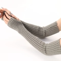 Detail of grey knitted arm warmers with ribbed texture and thumb holes for women - Light Gray
