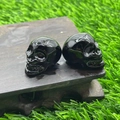 Carved black natural stone mini crystal skulls 2.8cm figurine in polished finish - Obsidian