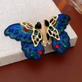 Dettaglio di orecchini vintage a farfalla con ricamo blu e cristalli colorati - 14# Perno in Argento