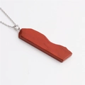 Detailed macro view of a red agate slice pendant with gold-plated edges and silver chain - Red Jasper (Silver Chain)