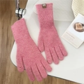 Detail of pink knitted gloves with a small brown leather tag on a soft knit wristband - One Size / Mixed Pink