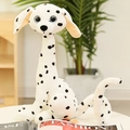 Long-necked spotted dog plush toy with blue big eyes on a white table background - Spotted Dog