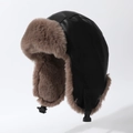 Windproof winter trapper hat with black faux leather shell and warm brown plush lining - One Size / Black