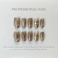 Cat eye press-on nails in coffee gold with yellow rhinestone accents on a display board - Large L (516 Crystal Cat Eye Glitter Short Trapezoid)