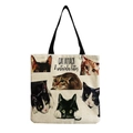 Detail of canvas tote bag showing watercolor cat illustrations and black fabric handles - Watercolor Kitties