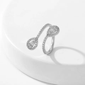 Detailed view of pear-cut zircon stones on an adjustable silver open ring band - Style 7 / Silver