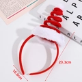Christmas headband with red spring design and white pompoms measuring 23.3cm by 10.8cm - Spiral Christmas Hat