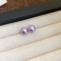 Elegant purple pearl stud earrings with gold plating on a beige corduroy tray - Oval Style (Diameter 8mm) / Purple