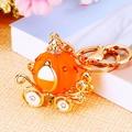 Orange pumpkin carriage keychain with gold wheels and sparkling crystals - Jelly Pumpkin Carriage Orange