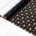 Gift wrapping paper roll in matte black with metallic gold crown and heart pattern - Crown