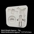 Space themed silicone mold featuring astronaut, planet and rocket for cake decorating - Gray